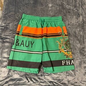 SHEIN Green and Orange Striped Athletic Shorts with Crest Detail